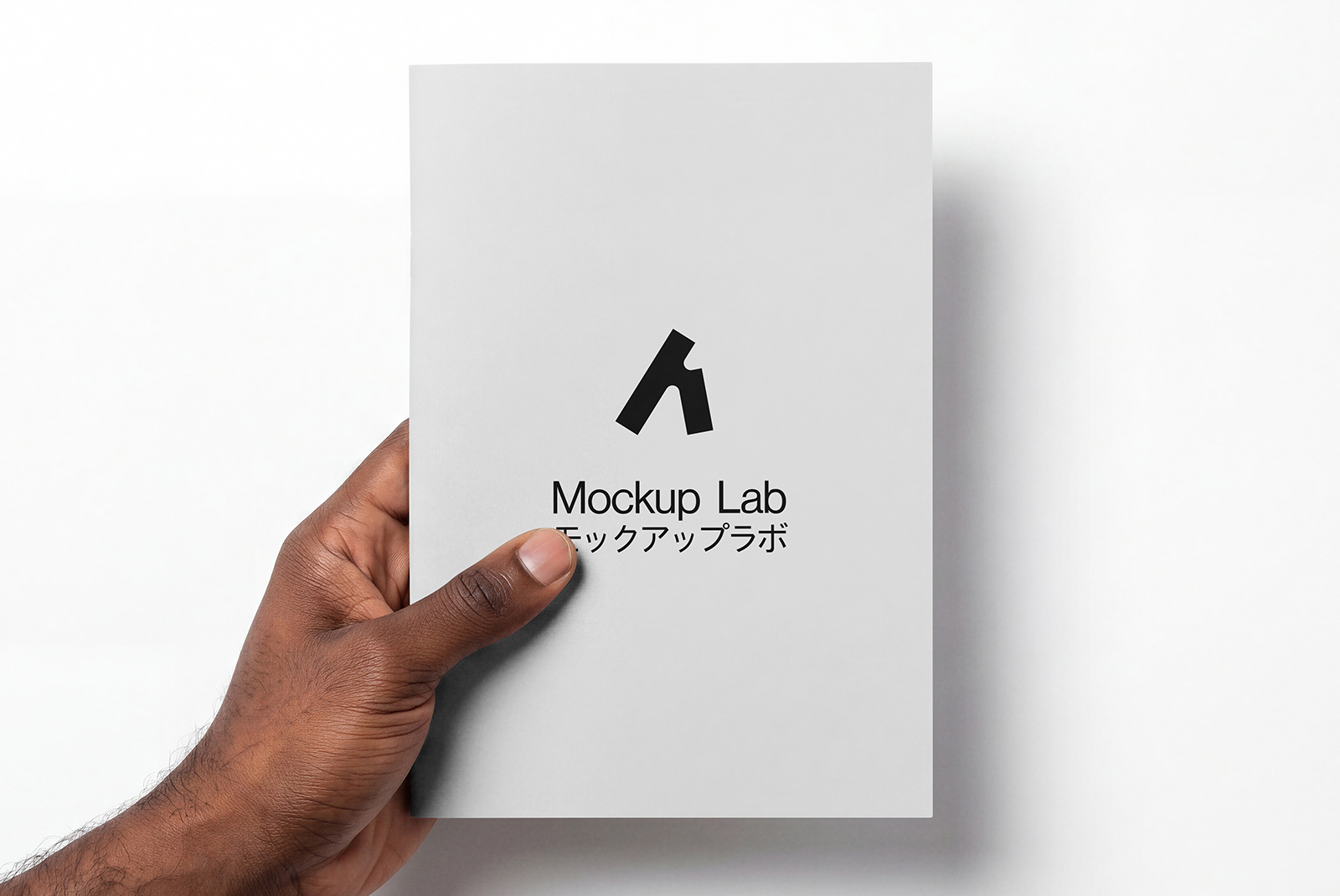 Close-up view of the open Notebook 04ML mockup, showing inner page layouts and cover detail.
